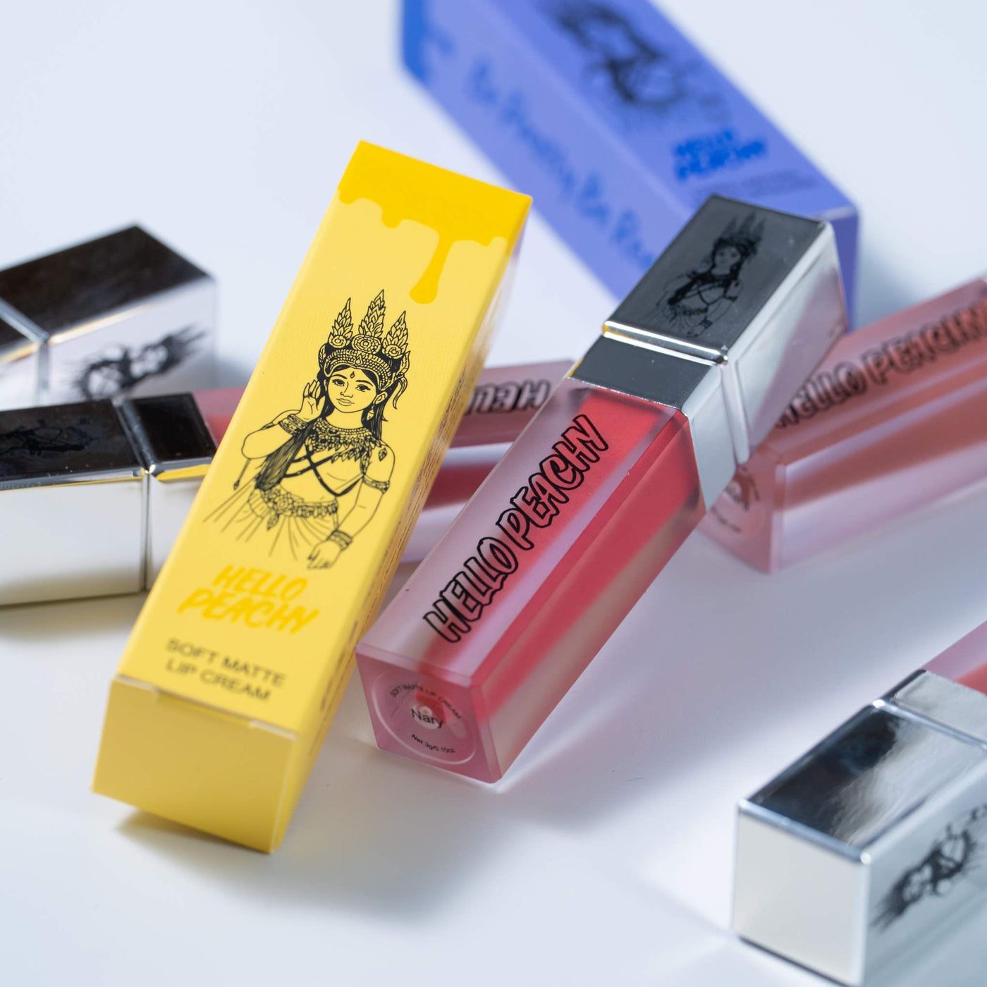 Soft matte lip cream tubes and pink Hello Peachy packaging